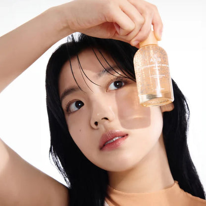 Woman holding Abib Glutathiosome Dark Spot Serum Vita Drop 50ml- with dropper