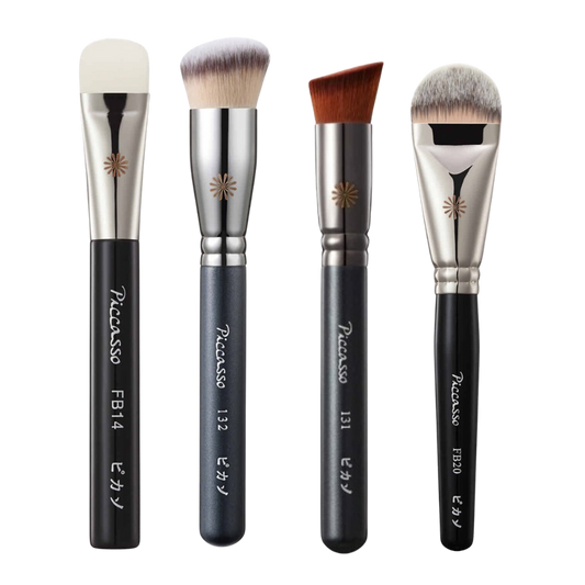 A Picasso Foundation Brush with soft bristles and a sleek handle.