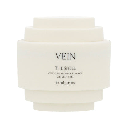 A 30ml white container with TAMBURINS THE SHELL Perfume Hand, featuring a cream-colored shell design. #VEIN