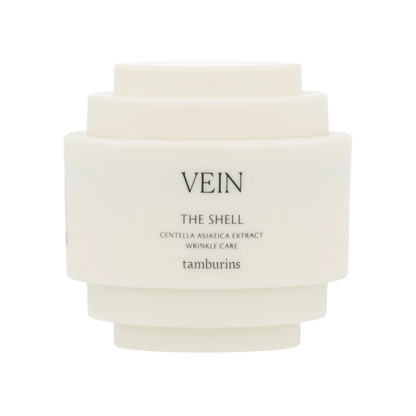 Cream-colored shell design on a 30ml white container of TAMBURINS THE SHELL Perfume Hand. #VEIN