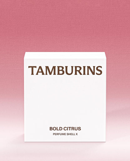 A variety of colorful tambourines with citrus slices and flowers, emitting a fragrant perfume.