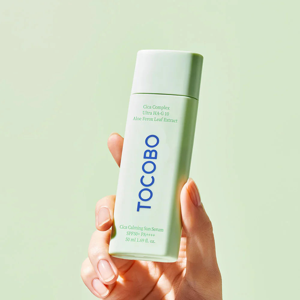 An image of person holding a TOCOBO Cica Calming Sun Serum SPF50+ PA++++ 50ml
