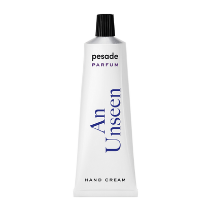 A 50ml tube of Pesade An Unseen Hand Cream, designed for moisturizing and nourishing dry hands effectively.
