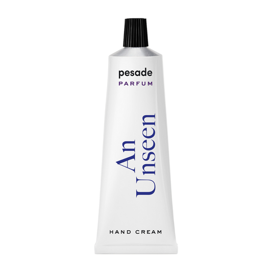 A 50ml tube of Pesade An Unseen Hand Cream, designed for moisturizing and nourishing dry hands effectively.
