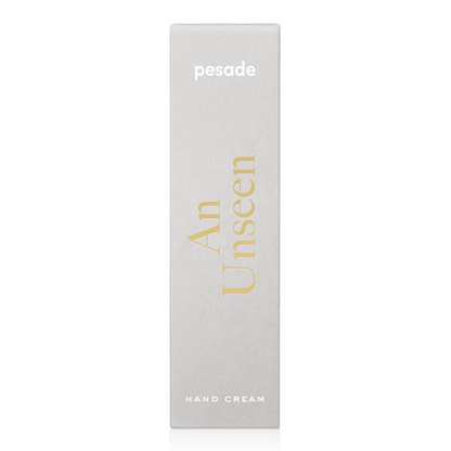 A 50ml container of Pesade An Unseen Hand Cream, formulated to deeply moisturize and protect hands from dryness.