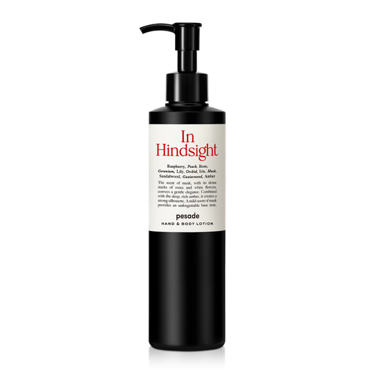 Hand and body lotion in a 250ml bottle, labeled "In Hindsight" by Pesade, designed for moisturizing and nourishing skin.