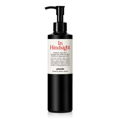 Hand and body wash bottle, 250ml, featuring a sleek design and the label "In Hindsight" by Pesade.
