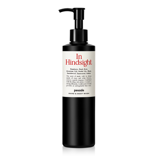 Hand and body wash bottle, 250ml, featuring a sleek design and the label "In Hindsight" by Pesade.
